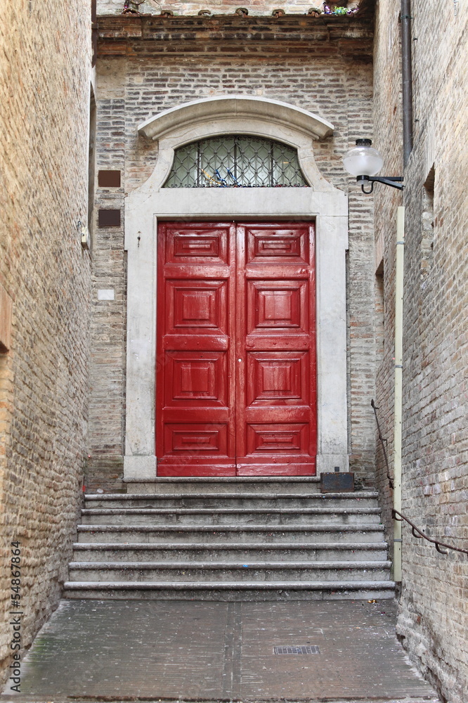 Medieval front door in Urbino, Italy