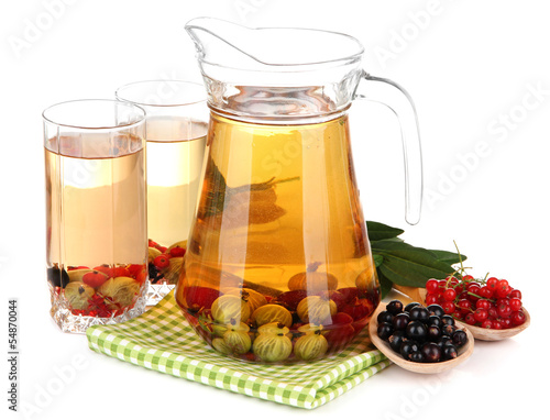 Foto Pitcher and glasses of compote with summer berries isolated