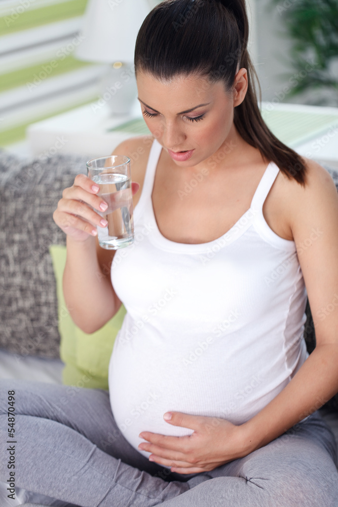 Pregnant woman drinking water