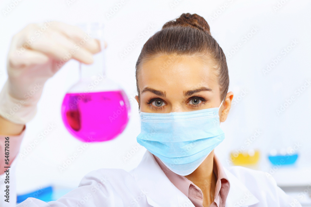 Young female scientist working in laboratory Young female scientist working in laboratory