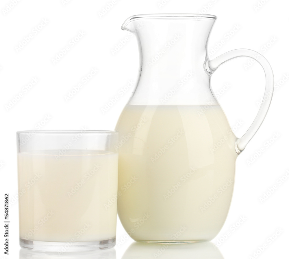 Milk in jug and glass isolated on white Milk in jug and glass isolated on white