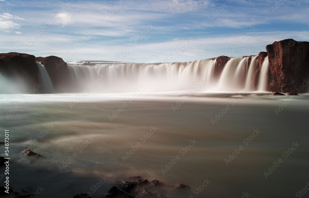 Godafoss waterfalls with mountain in Iceland Godafoss waterfalls with mountain in Iceland