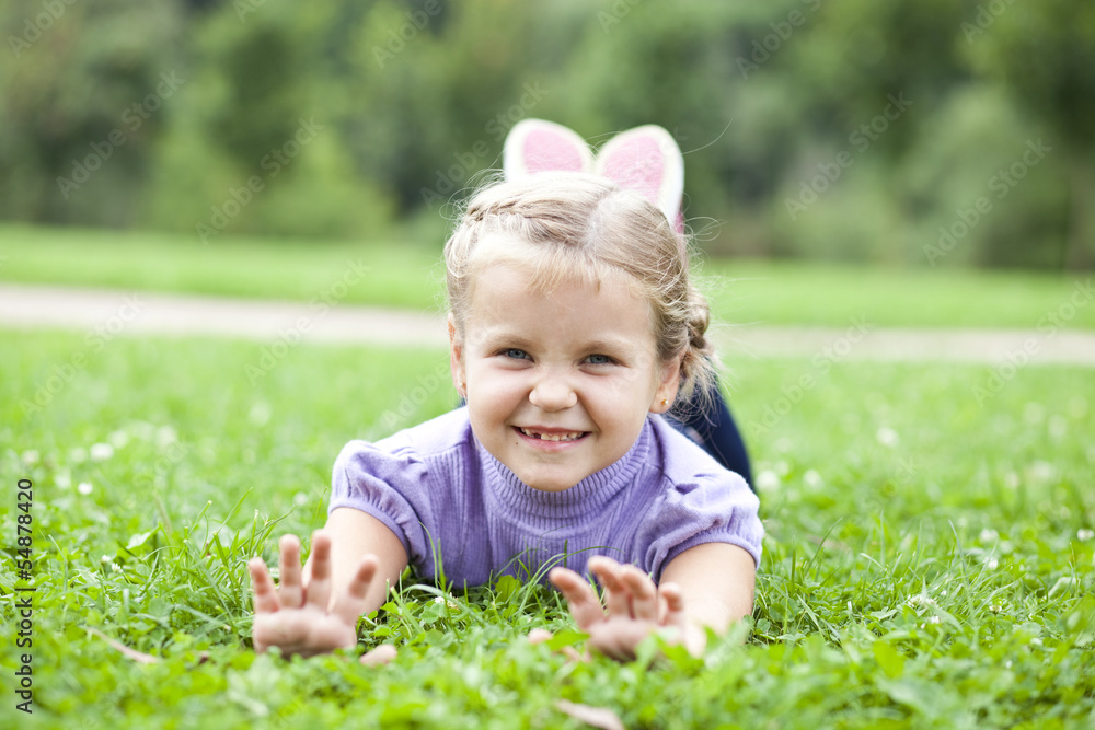 Cute little girl on the meadow in summer day Cute little girl on the meadow in summer day