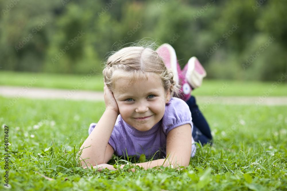 Cute little girl on the meadow in summer day Cute little girl on the meadow in summer day