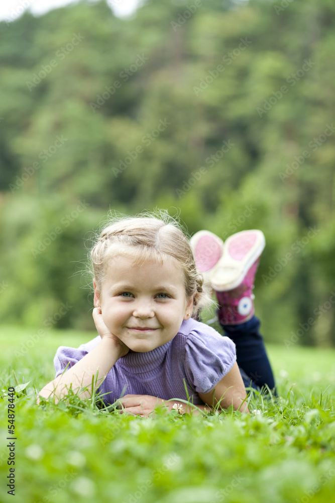 Cute little girl on the meadow in summer day Cute little girl on the meadow in summer day