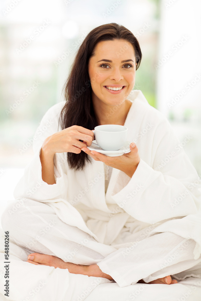 young woman in pajamas drinking coffee young woman in pajamas drinking coffee