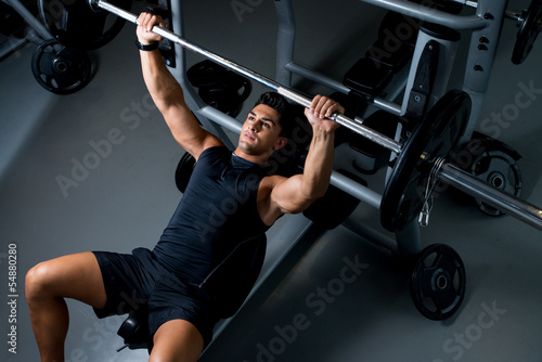 Young Man Working Out in the Gym