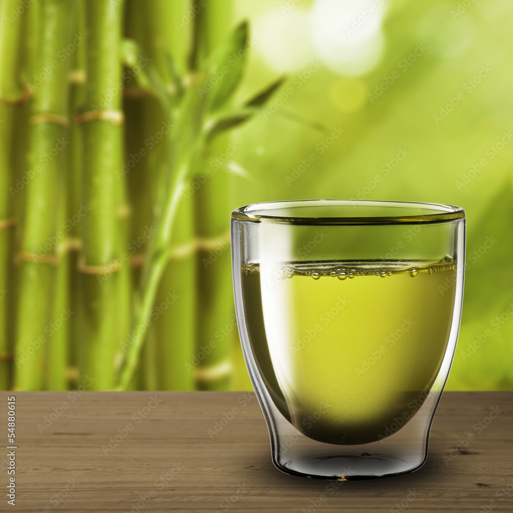 Glass of green tea with bamboo background Glass of green tea with bamboo background
