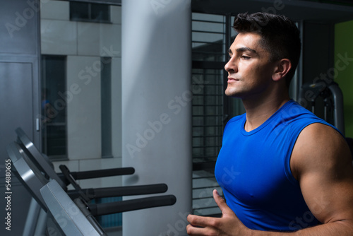 Man jogging in a gym