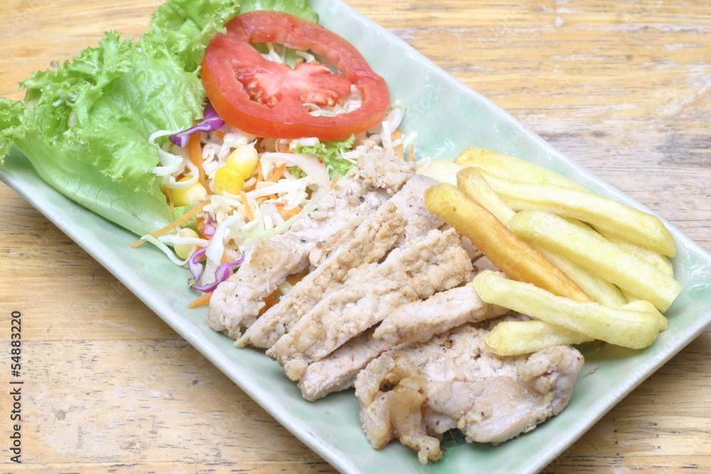 fried pork with salad