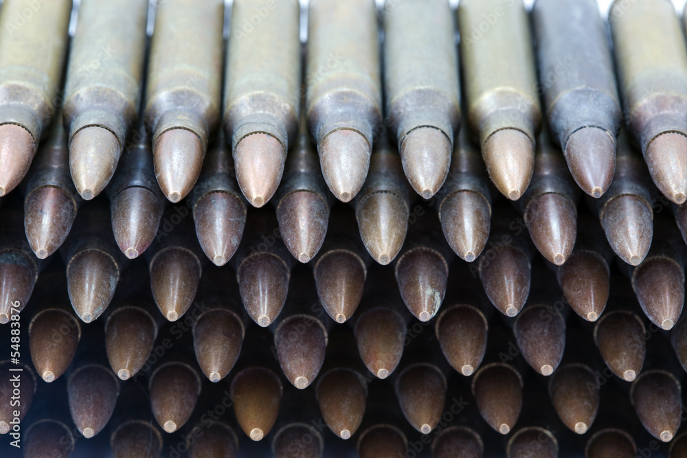 A stack of 5.56mm rifle cartridges. Shot from a high angle. A stack of 5.56mm rifle cartridges. Shot from a high angle.