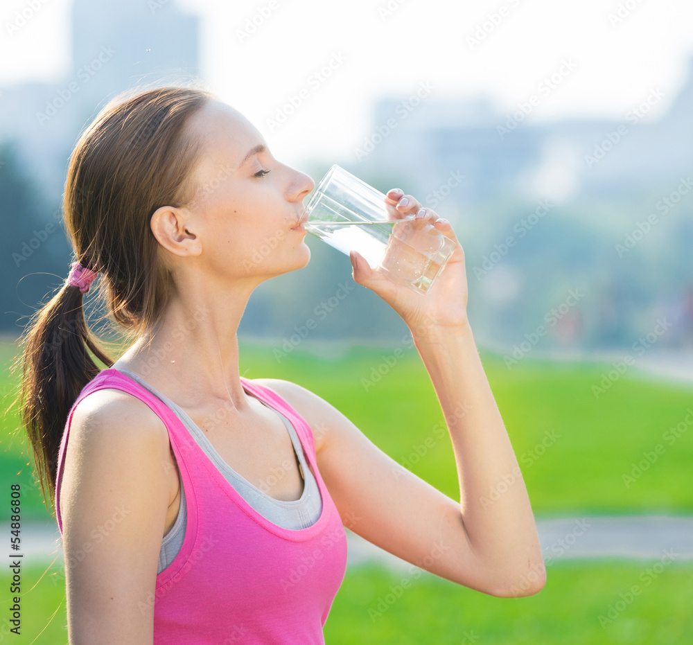 Portrait of woman drinking water after sport Portrait of woman drinking water after sport