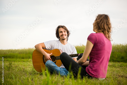 Playing guitar - dating couple