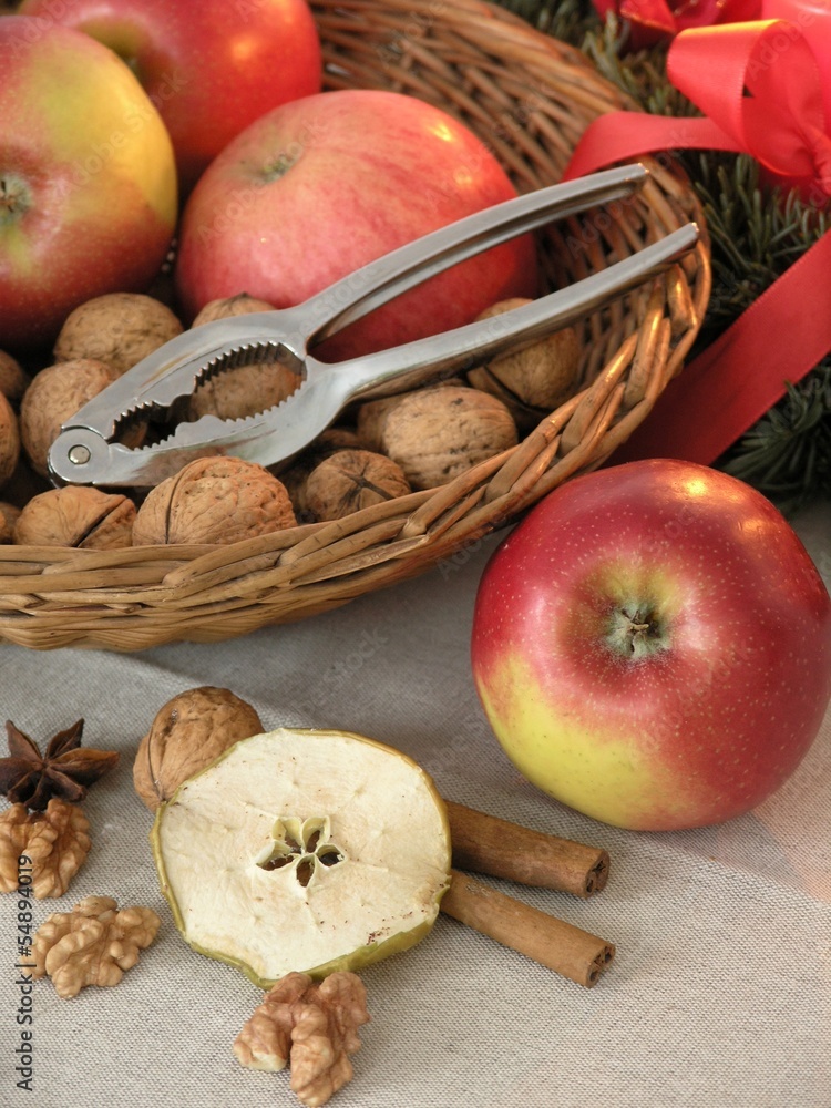 Basket with apples, walnuts and nutcracker. Basket with apples, walnuts and nutcracker.