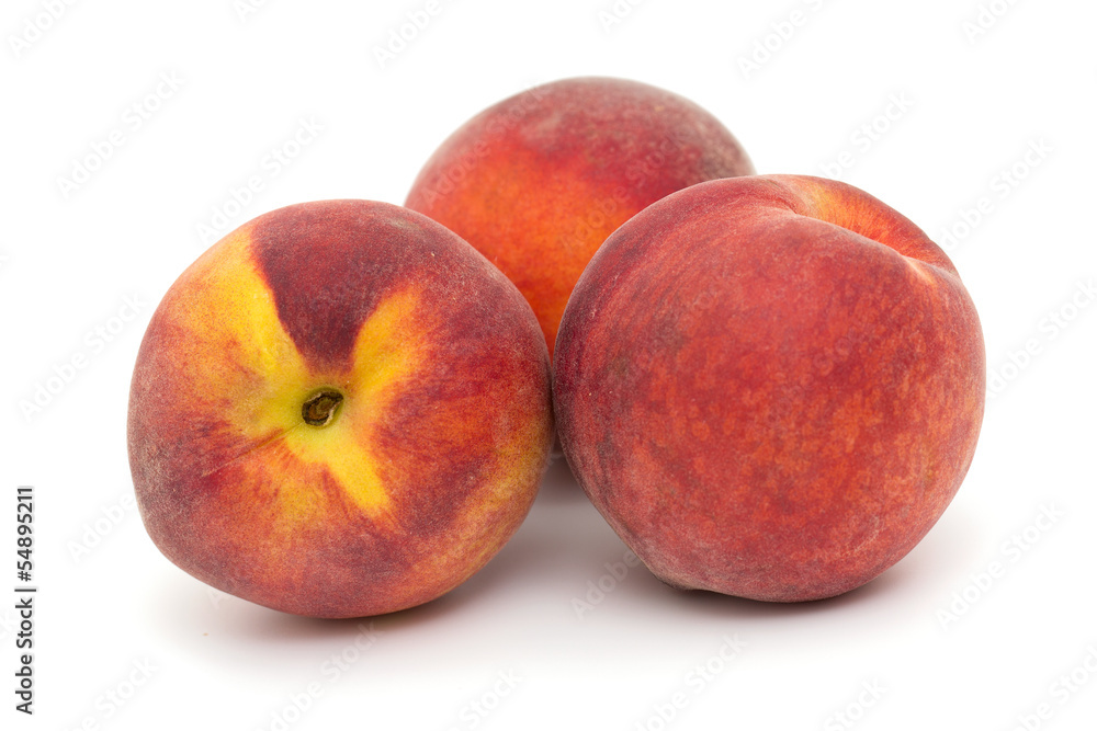three ripe peaches