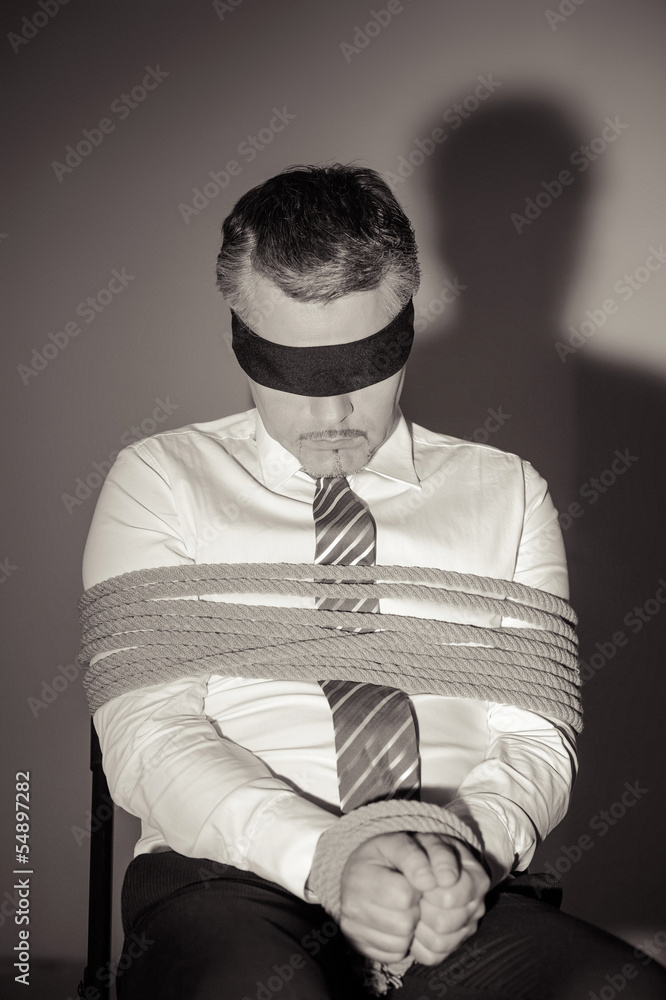Kidnapped businessman. Black and white image of Tied up man in s Stock ...