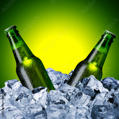 Beer bottles on ice cube photo