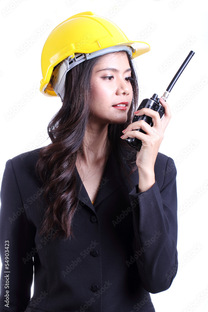 female construction worker talking with a walkie talkie female construction worker talking with a walkie talkie