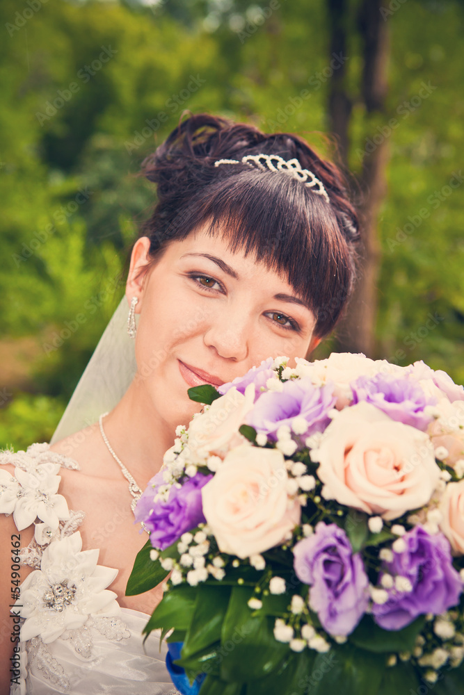 Obraz premium Portrait of a beautiful smiling bride