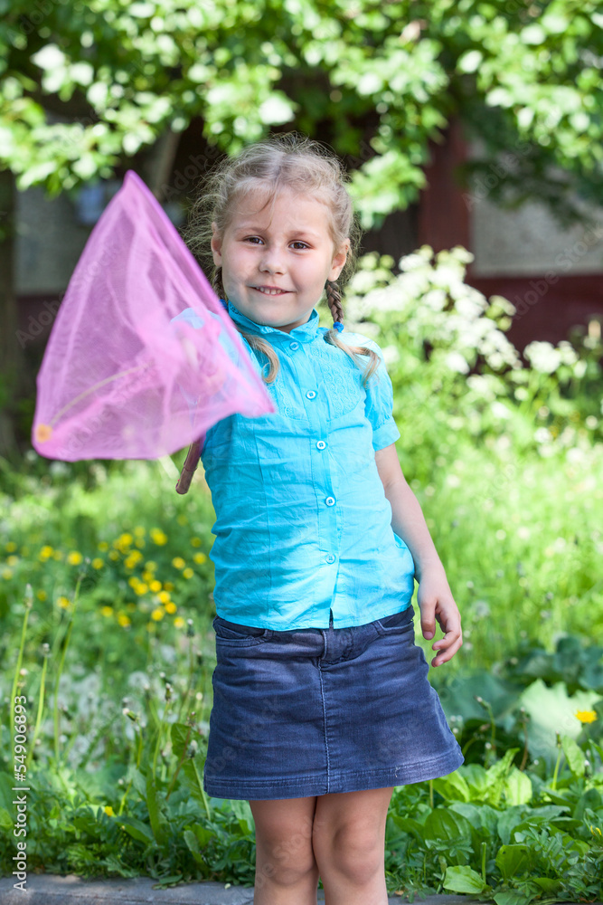 Happy Caucasian child showing butterfly net