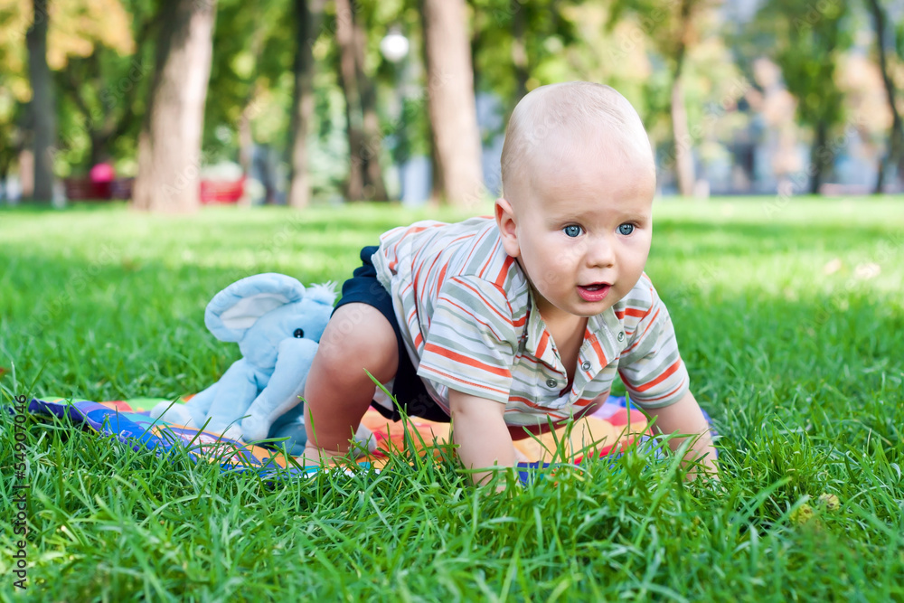 Baby boy learning to crawl