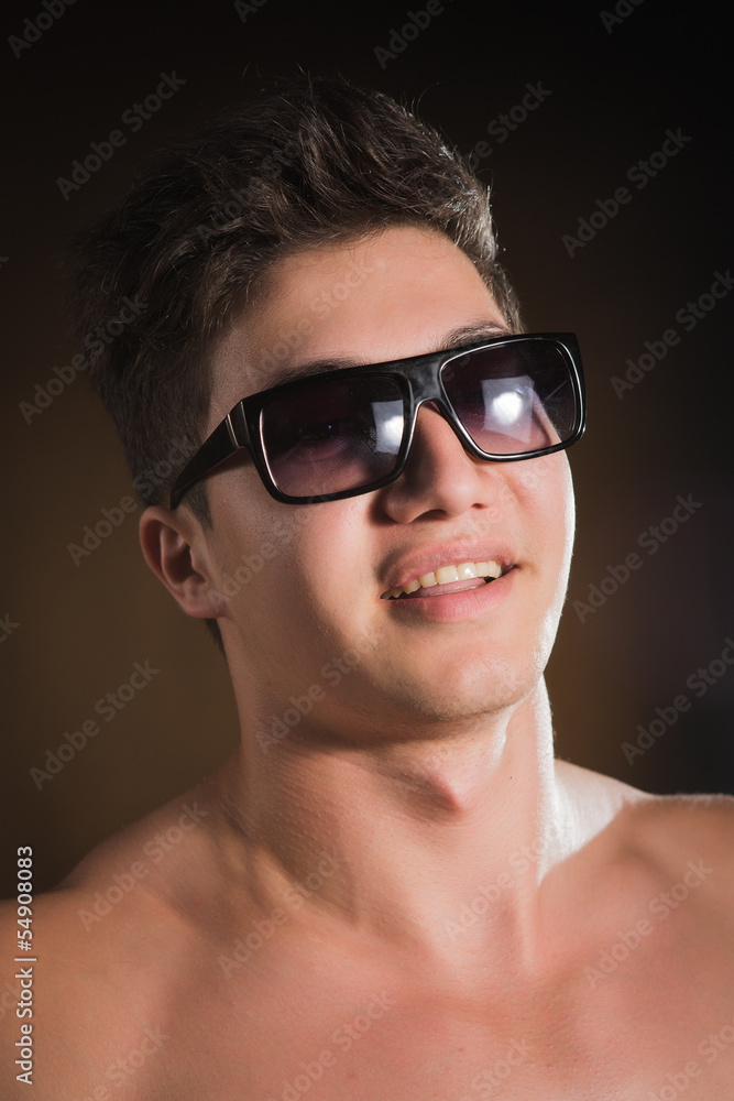 Beauty image of glam guy. Face close-up. Isolated on black. Beauty image of glam guy. Face close-up. Isolated on black.