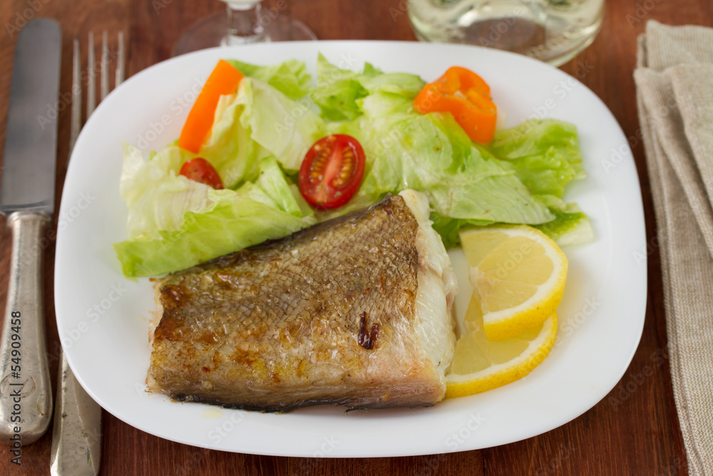 fried fish with salad and lemon fried fish with salad and lemon