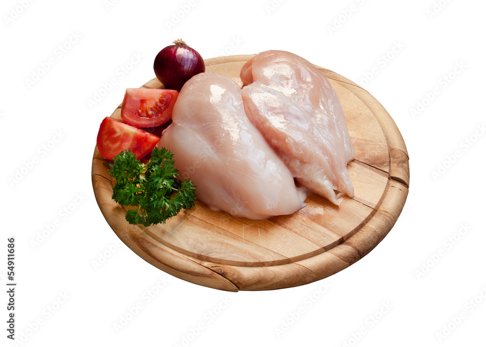 Isolated cutting board with raw chicken breast Isolated cutting board with raw chicken breast