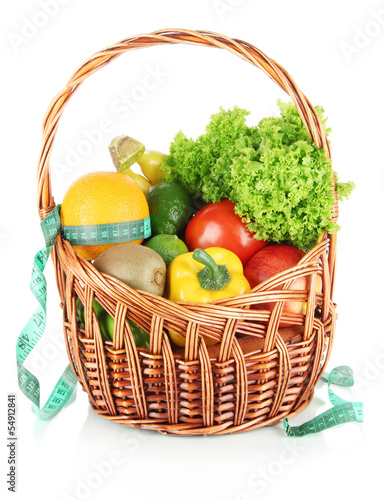 Fresh vegetables in wicker basket isolated on white