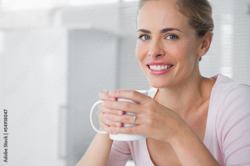 Cheerful blonde having coffee Cheerful blonde having coffee