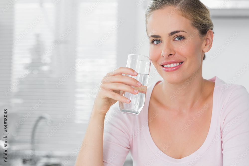 Woman holding glass of water Woman holding glass of water