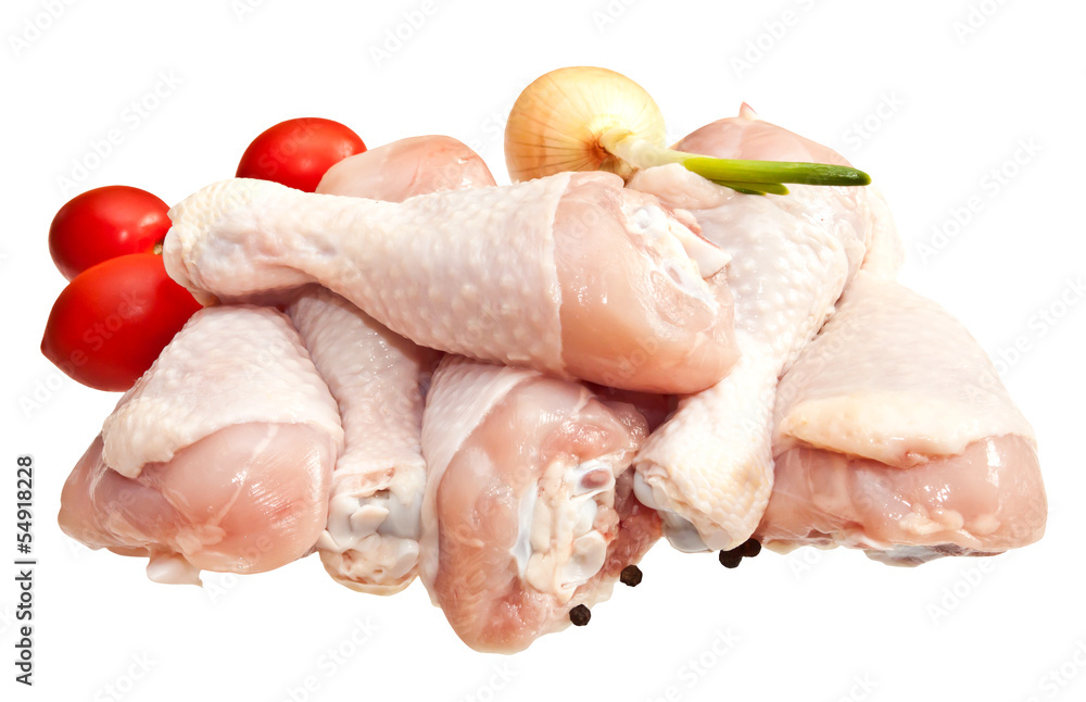 Raw chicken legs with vegetables, isolated on white background Raw chicken legs with vegetables, isolated on white background