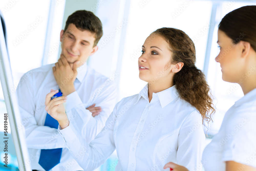 businessmen are meeting near the flipchart businessmen are meeting near the flipchart