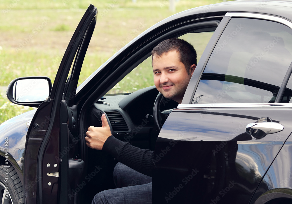 man driving a car