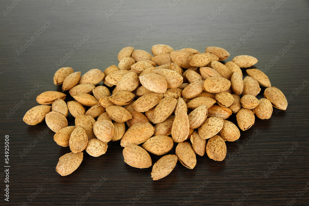Almond on dark wooden background Almond on dark wooden background