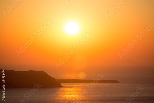 Beautiful sunset at the beach of Santorini in Greece