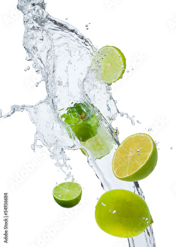 Fresh lime falling in water splash, isolated on white backgro