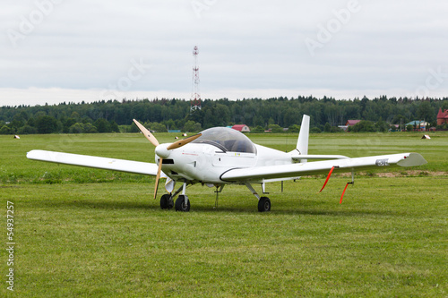 small wite airplane on the ground