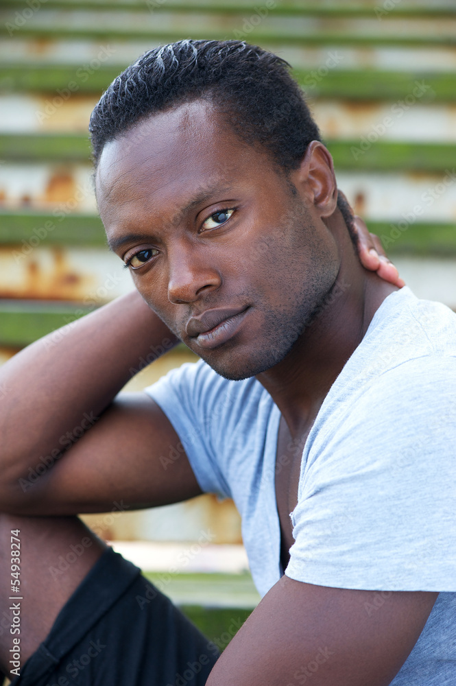 Portrait of a young black man relaxing outdoors Portrait of a young black man relaxing outdoors