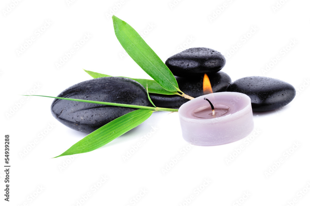 Fototapeta premium bamboo leaf and zen pebbles over white