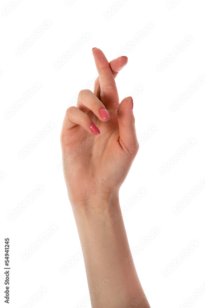 Woman hand with fingers crossed isolated on white Woman hand with fingers crossed isolated on white
