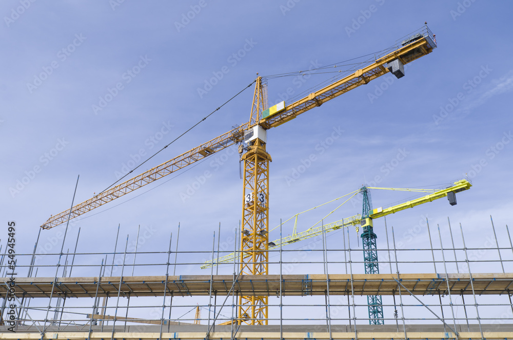 cranes on construction site cranes on construction site