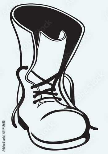 Old dirty boots isolated on blue background