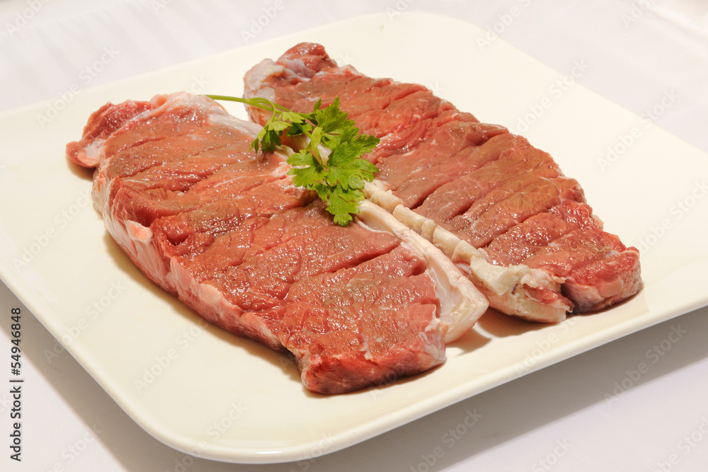 beef steak raw entrecot with parsley
