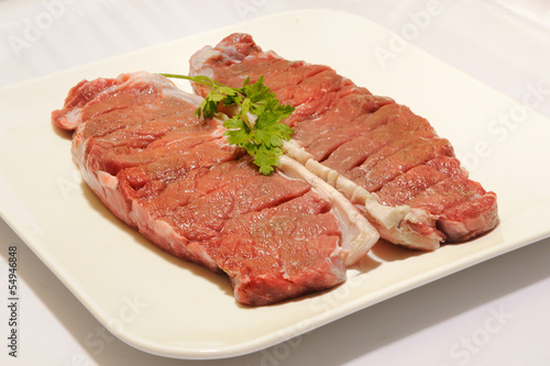 beef steak raw entrecot with parsley