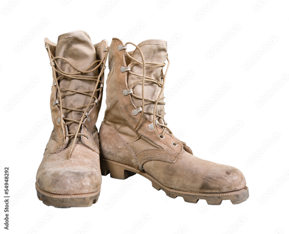 Old combat boots isolated over white Old combat boots isolated over white