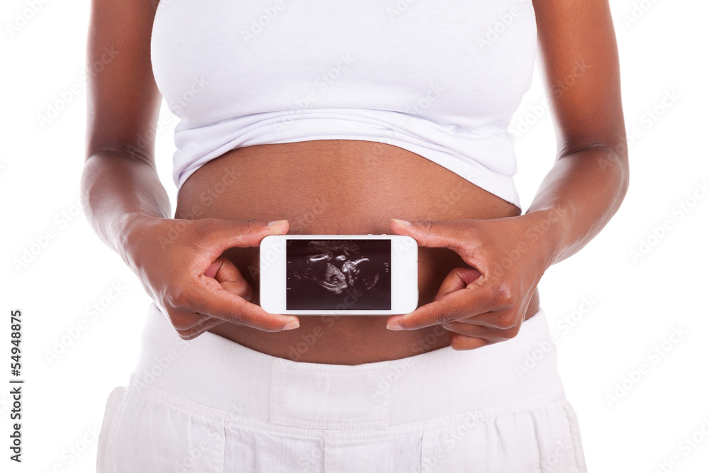 Young pregnant black woman showing an ultrasound picture of her