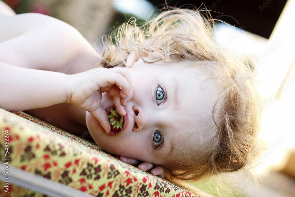 Little baby eating strawberry Little baby eating strawberry