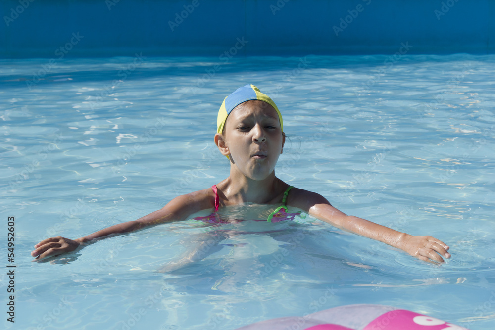 young girl swims play in pool
