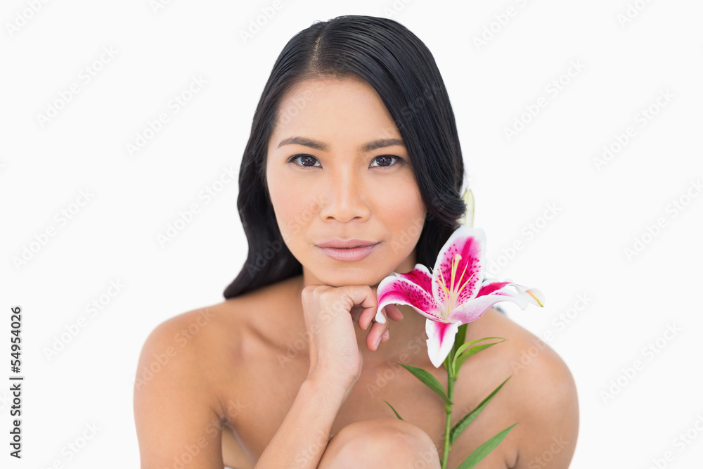 Natural model with lily touching her chin Natural model with lily touching her chin